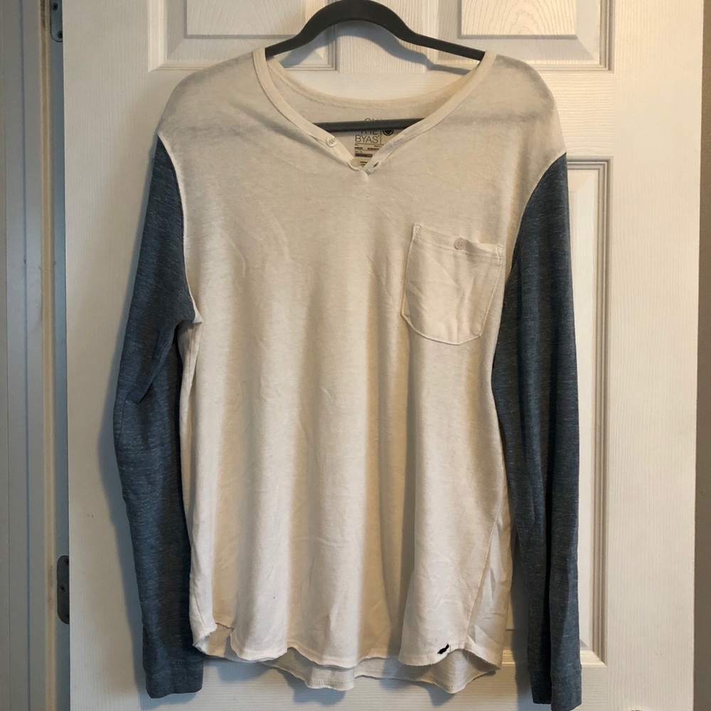 On the Byas cream Henley with blue sleeves